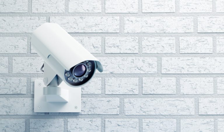 surveillance camera on a brick wall